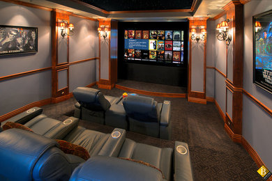 This is an example of a mid-sized traditional enclosed home theatre in Other with purple walls and a projector screen.