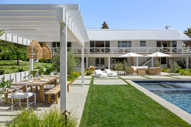Example of a beach style home design design in Orange County