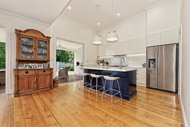 This is an example of a shabby-chic style kitchen in Brisbane.