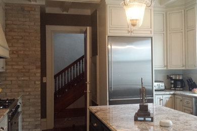 Inspiration for a modern u-shaped eat-in kitchen remodel in Minneapolis with a drop-in sink
