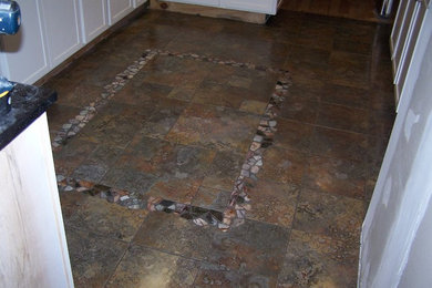 Example of a porcelain tile kitchen design in Boston