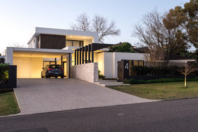 This is an example of a large modern two-storey white house exterior in Perth with wood siding, a flat roof and a metal roof.