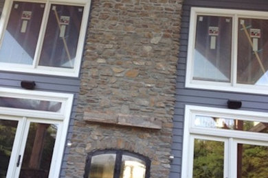 Inspiration for a brown one-story brick exterior home remodel in Kansas City