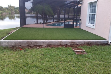 Photo of a large traditional drought-tolerant and full sun backyard landscaping in Jacksonville.