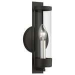 Livex Lighting - Castleton 1 Light Black With Brushed Nickel Candle ADA Single Sconce - A glass cylinder shines with light as steel straps and a rounded back plate ground this Castleton sconce with a modern style. The clean, transitional, versatile sleek look will add romantic light while maintaining your minimalist interior. This beautiful sconce comes in a black finish.  With its easy installation and low upkeep requirements, this light will not disappoint.