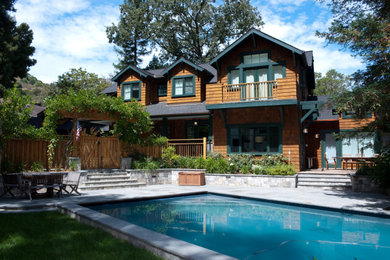 Example of a large mountain style brown two-story wood and shingle exterior home design in San Francisco with a shingle roof and a gray roof
