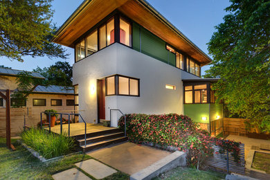 Inspiration for a large contemporary white two-story stucco exterior home remodel in Austin