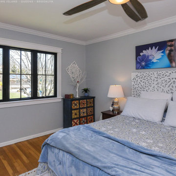 New Black Windows in Stylish Bedroom - Renewal by Andersen Long Island, Queens &