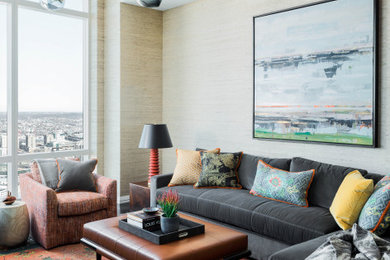 Contemporary living room in Boston with beige walls and wallpaper.