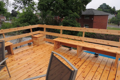 Inspiration for a mid-sized contemporary rooftop deck in Toronto with no cover.