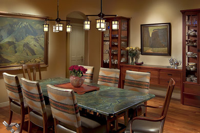 Enclosed dining room - mid-sized mediterranean light wood floor enclosed dining room idea in Phoenix with beige walls