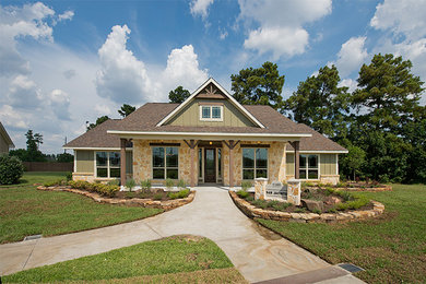 Mid-sized mountain style green one-story mixed siding exterior home photo in Houston with a shingle roof