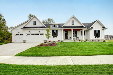 Farmhouse white one-story house exterior photo in Minneapolis with a gray roof
