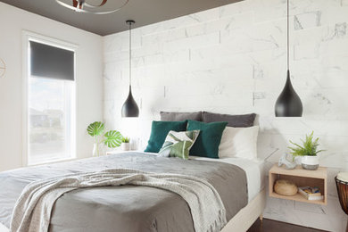 Mid-sized trendy master dark wood floor and brown floor bedroom photo in Montreal with white walls