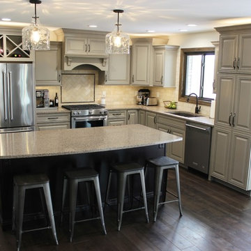 Farmhouse kitchen Taupe Painted Cabinets,Quartz Tops, and Dark Island