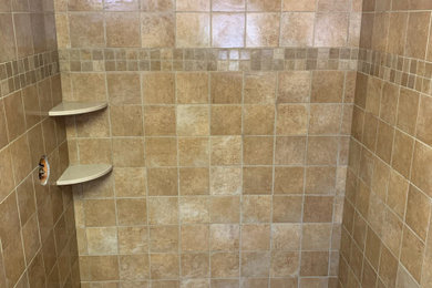 This is an example of a mid-sized transitional master bathroom in Boston with an alcove shower and porcelain tile.