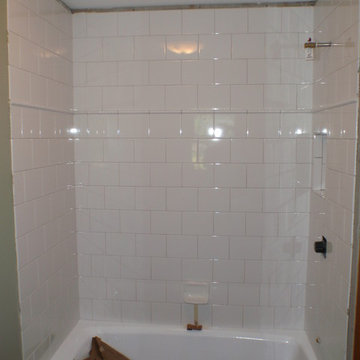 Refinishing an outdated cast iron tub and Installing a new tiled shower