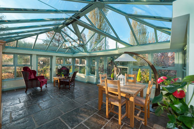 Design ideas for an expansive traditional sunroom in London.