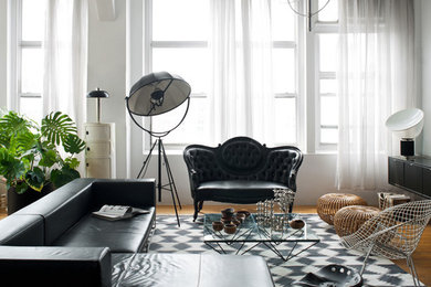 Inspiration for a victorian enclosed medium tone wood floor living room remodel in New York with white walls