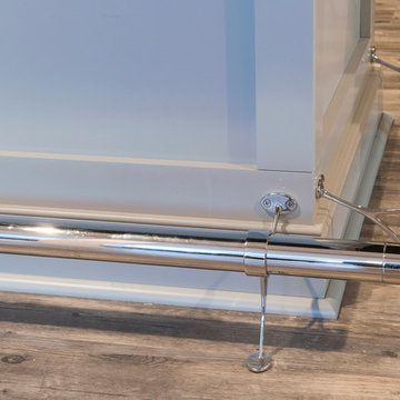 Basement Bar with Foot rail, Luxury Vinyl Flooring, and Gray Cabinets