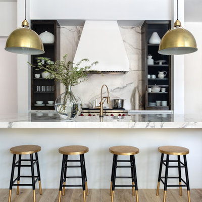 Inspiration for a huge transitional u-shaped light wood floor open concept kitchen remodel in Houston with a farmhouse sink, flat-panel cabinets, gray cabinets, gray backsplash, an island and white countertops