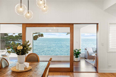 Photo of a beach style dining room in Brisbane.