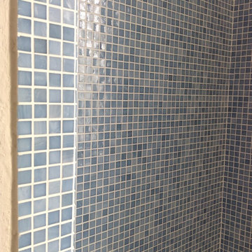 Light blue bathroom with bamboo flooring
