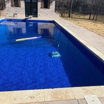 Polymer vinyl liner pool w/concrete spillover spa & automatic pool cover