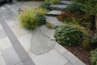 This is an example of a garden in Essex with natural stone pavers.
