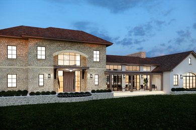 Large french country two-story stone house exterior photo in New York with a brown roof