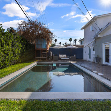 Modern black pebble pool & spa | small backyard