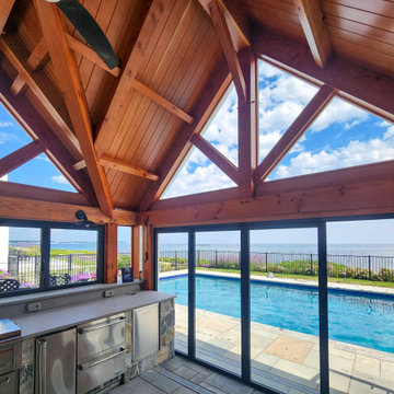 Thermally Broken Aluminum Glass Walls Frame the Pool and Ocean View