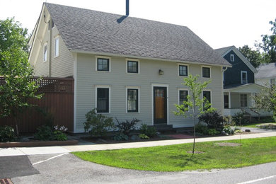 Mid-sized craftsman green two-story concrete fiberboard exterior home idea in Burlington