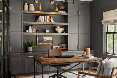 Study room - mid-sized transitional freestanding desk medium tone wood floor and brown floor study room idea in Minneapolis with gray walls