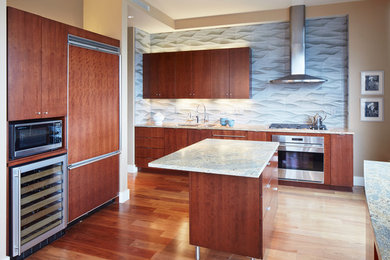 Inspiration for a mid-sized contemporary kitchen remodel in Portland with flat-panel cabinets and an island
