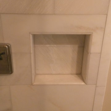 BATHROOM - Calcutta Gold Marble Shower / Gray Penny Tile Floor