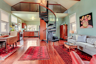 Example of a mid-sized eclectic loft-style dark wood floor living room design in Chicago with green walls