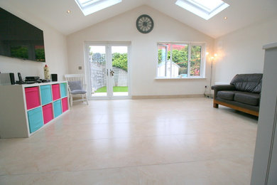 Large contemporary kitchen/diner in Dublin with porcelain flooring.