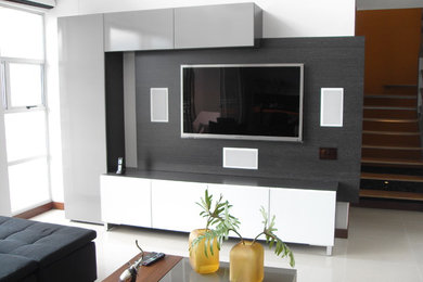 Living room - mid-sized contemporary formal and open concept porcelain tile and white floor living room idea in Miami with white walls, no fireplace and a media wall