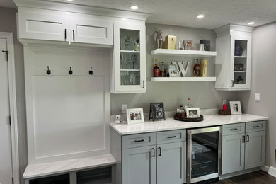 Example of a classic home bar design in Other