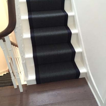 Black Carpet with Black Binding Installed to Stairs