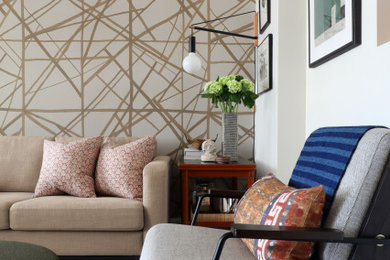 Living room - small 1960s enclosed dark wood floor and wallpaper living room idea in New York with beige walls, no fireplace and a tv stand