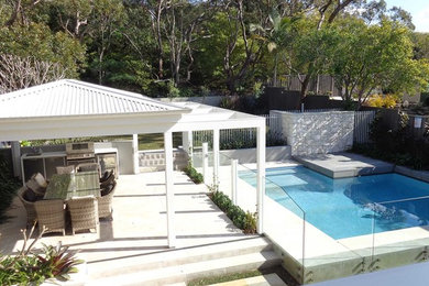This is an example of a beach style pool in Sydney.