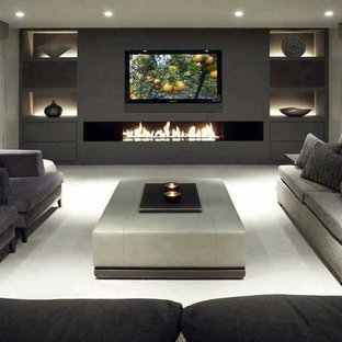 Design ideas for a large modern home cinema in Sydney with grey walls and a wall mounted tv.