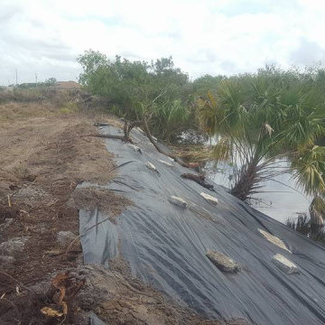 Invasive Vegetation and Fresh Water Canal Bank Stabilization for RipRap Install