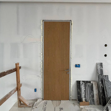 Hidden doors with laminated Walnut