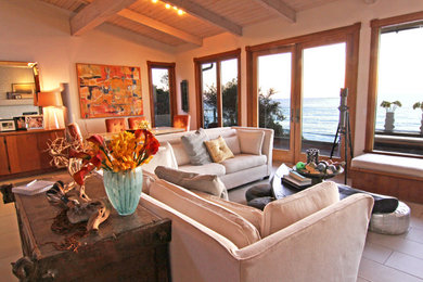 Inspiration for an eclectic open concept family room remodel in San Diego with beige walls
