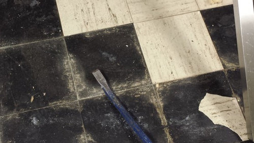 What to do with wet Asbestos floor tile and black adhesive