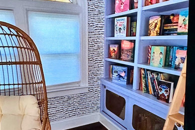 Inspiration for a mid-sized mid-century modern dark wood floor and wallpaper home office library remodel in Other
