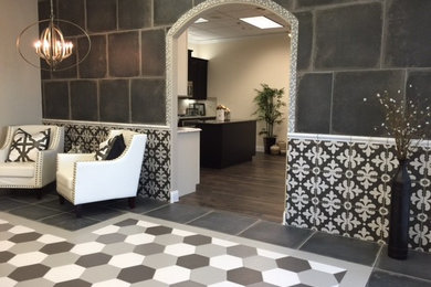 Example of a mid-sized transitional slate floor foyer design in Austin with gray walls